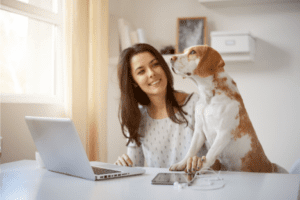 Woman at Laptop Computer with Dog