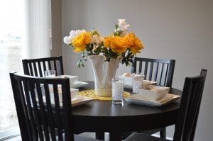 yellow flowers at dining room table